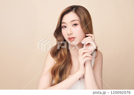Beautiful young asian woman with clean fresh skin on beige background, Face care, Facial treatment, Cosmetology, beauty and spa, Asian women portrait. 120092076