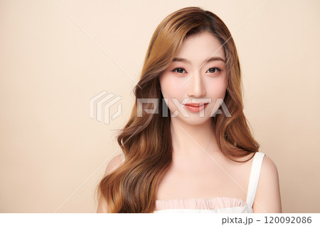 Beautiful young asian woman with clean fresh skin on beige background, Face care, Facial treatment, Cosmetology, beauty and spa, Asian women portrait. 120092086