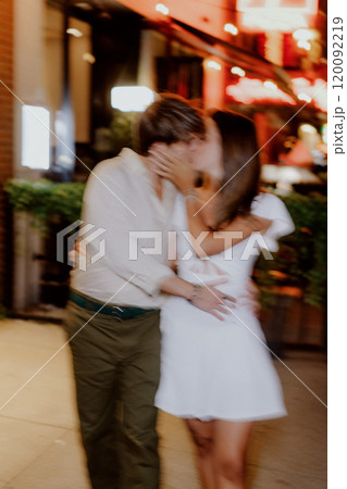 Enjoying a Romantic Evening Stroll in Comfortable and Casual Attire Under the Stars 120092219