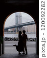 A Beautiful and Romantic Silhouette Captured Under a Bridge During the Enchanting Dusk 120092282