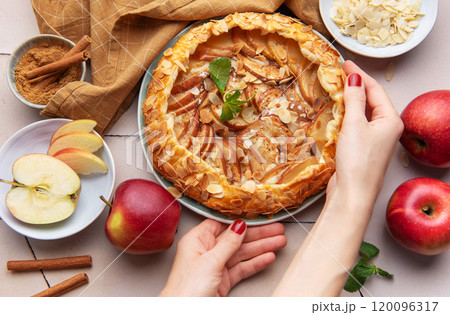 Apple galette preparation with fresh ingredients and spices on a kitchen countertop Apple galette preparation with fresh ingredients and spices on a kitchen countertop 120096317