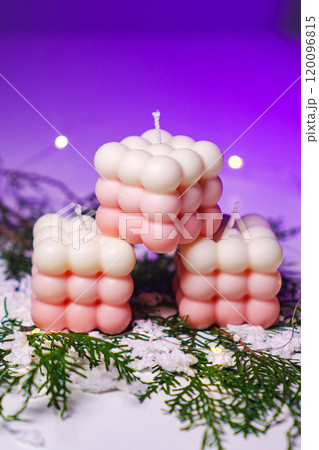 Cute white and pink Bubble candles on purple background. Cute white and pink Bubble candles on purple background. 120096815