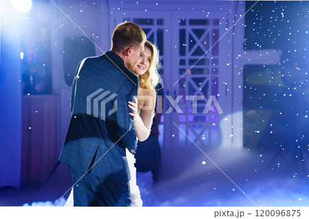 Beautiful and happy bride and groom dancing first dance at wedding. Beautiful and happy bride and groom dancing first dance at wedding. 120096875