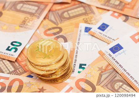 A Stack of Bitcoin Coins on the 50 Euro Banknotes A Stack of Bitcoin Coins on the 50 Euro Banknotes 120098494
