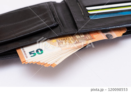 Opened Black Leather Men Wallet with Euro Banknotes Inside on White Background Opened Black Leather Men Wallet with Euro Banknotes Inside on White Background 120098553