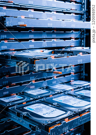 close up of hard disk drives inside hosting center 120098952