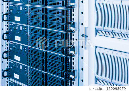 Cluster of data storage hard drives inside server room 120098979
