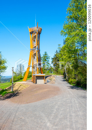 The Hamstejn lookout tower stands tall with its spiral staircase and steel structure, surrounded by lush greenery in Bohemian Paradise, Czechia, inviting visitors to enjoy scenic views. The Hamstejn lookout tower stands tall with its spiral staircase and steel structure, surrounded by lush greenery in Bohemian Paradise, Czechia, inviting visitors to enjoy scenic views. 120099016