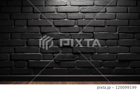 A single spotlight illuminates a black brick wall 120099199