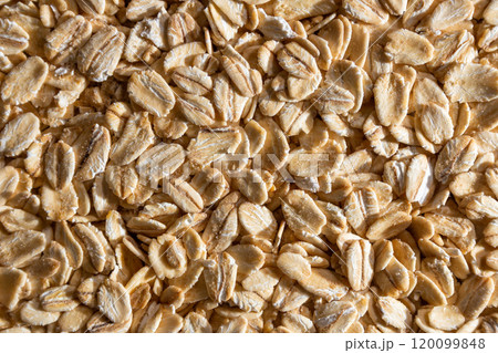 Dry Uncooked Oat Flakes background Dry Uncooked Oat Flakes background 120099848