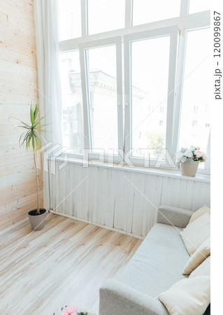 Interior of an empty white room with a window 120099867