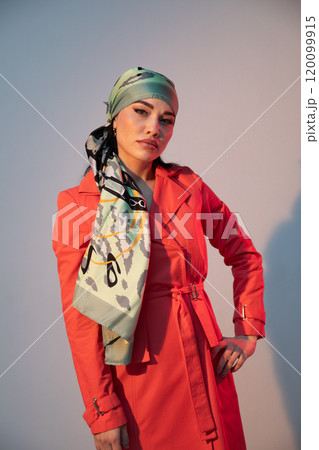 Portrait of a beautiful fashionable woman in a red autumn dress 120099915