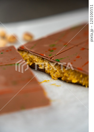 Trend Dubai chocolate with pistachio paste and kataifi dough. Confectionery handmade sweets at home in the kitchen.  120100551