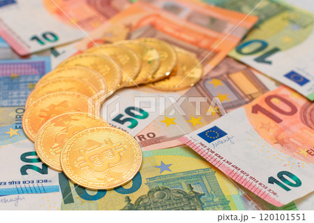 A Heap of Bitcoin Coins on the Euro Banknotes 120101551