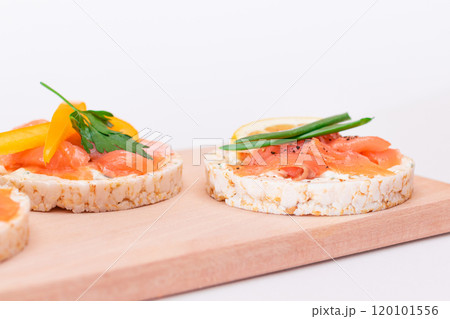 Rice Cake Sandwiches with Fresh Salmon, Cucumber, Yellow Paprika and Greens Rice Cake Sandwiches with Fresh Salmon, Cucumber, Yellow Paprika and Greens 120101556