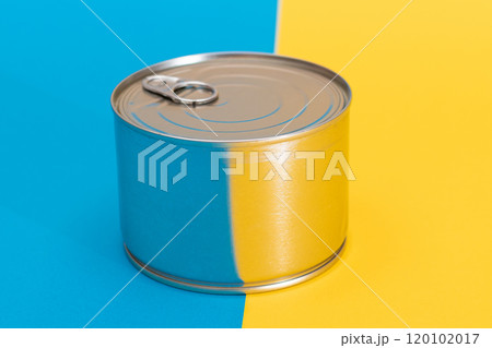 Tin Can on Split Blue and Yellow Background 120102017