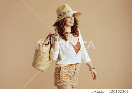 happy elegant woman in blouse and shorts isolated on beige happy elegant woman in blouse and shorts isolated on beige 120102301