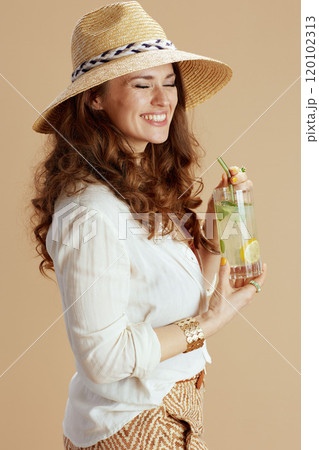 happy stylish woman in blouse and shorts isolated on beige happy stylish woman in blouse and shorts isolated on beige 120102313