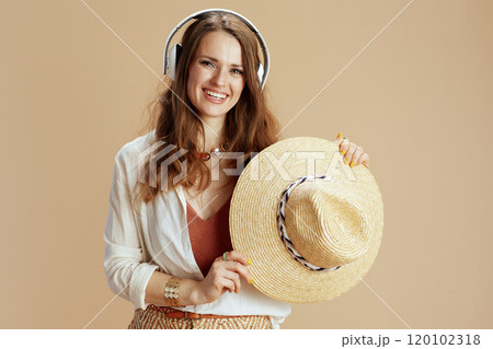 smiling woman in blouse and shorts isolated on beige smiling woman in blouse and shorts isolated on beige 120102318