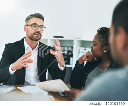This is where ideas turn into plans. Cropped shot of a group of corporate colleagues sitting in the boardroom during a meeting. This is where ideas turn into plans. Cropped shot of a group of corporate colleagues sitting in the boardroom during a meeting. 120103360