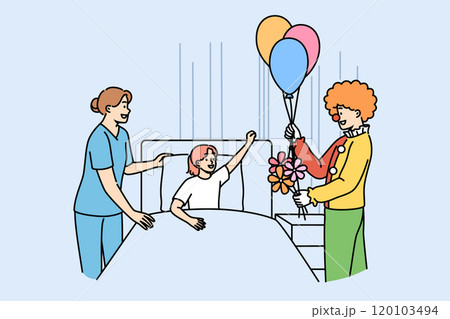 Clown entertains sick girl lying in bed in hospital to improve mood of child suffering from illness 120103494
