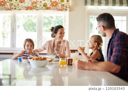 Having fun at the breakfast table. Shot of a family having breakfast together. Having fun at the breakfast table. Shot of a family having breakfast together. 120103543
