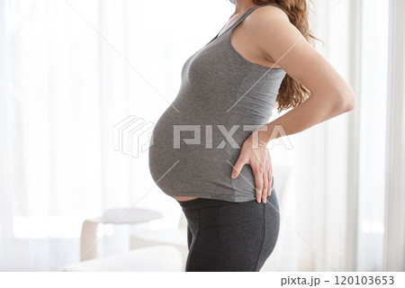 Life changes for the better when youre expecting. Cropped shot of a pregnant woman standing in her home. 120103653