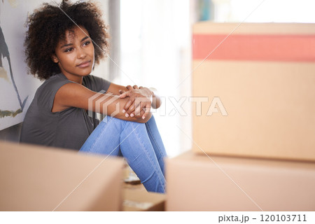 Heres to a new start. Shot of a young woman moving into her new house. Heres to a new start. Shot of a young woman moving into her new house. 120103711