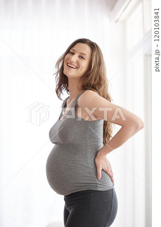 My babys definitely gonna be born healthy. Cropped portrait of a young pregnant woman standing in her home. 120103841