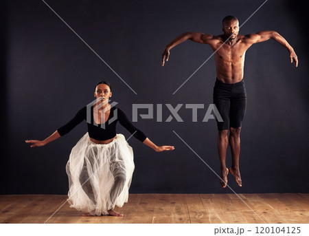 Flight. A female and male contemporary dancer performing a dramatic pose in front of a dark background. Flight. A female and male contemporary dancer performing a dramatic pose in front of a dark background. 120104125