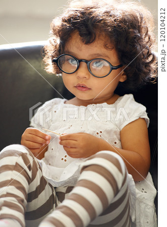 Learning as she grows. Shot of a cute little girl at home. 120104212