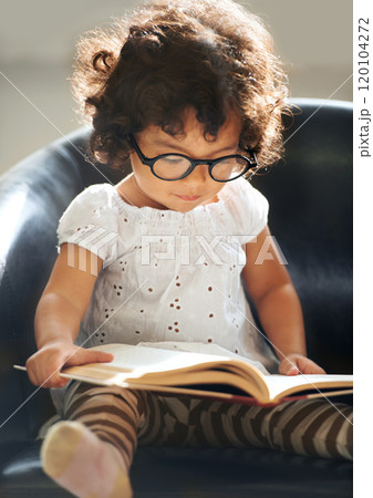 Learning as she grows. Shot of a cute little girl at home. Learning as she grows. Shot of a cute little girl at home. 120104272