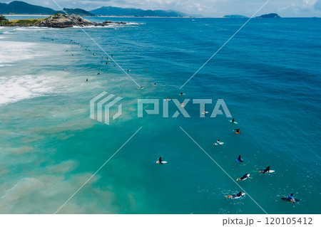 Surfers on surfboards in ocean waiting wave in Floripa. Aerial view in Brazil 120105412