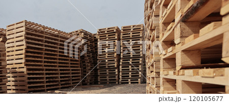 Wooden pallets for transportation of building materials. Eco-friendly products. Pallets made of renewable wood.Narrow banner. 120105677