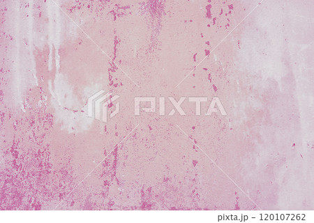 Textured pink plaster wall surface with peeling paint. Aged, weathered concrete background Textured pink plaster wall surface with peeling paint. Aged, weathered concrete background 120107262