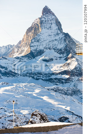 Snowy mountain Matterhorn during the day in winter. Zermatt, swiss alps 120107994