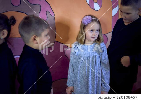 5-7 year old children at an acting class with their teacher, extracurricular activities 120108467