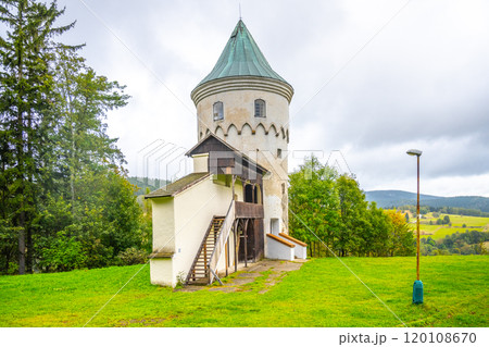 Slikovka Tower stands prominently in the Ore Mountains in Czechia, showcasing its historical architecture against a backdrop of lush greenery and rolling hills. Slikovka Tower stands prominently in the Ore Mountains in Czechia, showcasing its historical architecture against a backdrop of lush greenery and rolling hills. 120108670