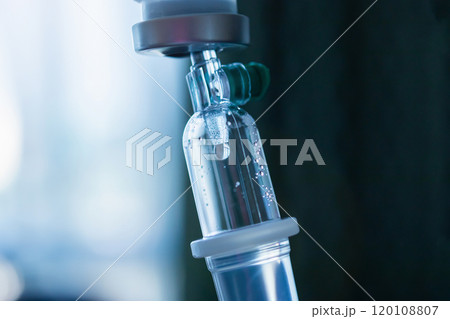 Close up medical intravenous IV drip in hospital background Close up medical intravenous IV drip in hospital background 120108807