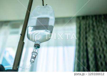 Close up medical intravenous IV drip in hospital background 120108812