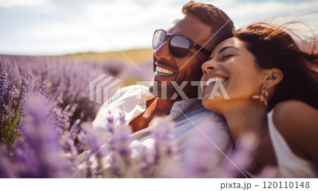 Young Interracial Couple Enjoying Sunshine in Summer Lavender Field copy space 120110148
