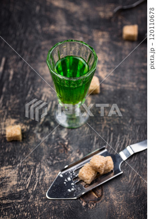 Glass of absinthe with cane sugar Glass of absinthe with cane sugar 120110678