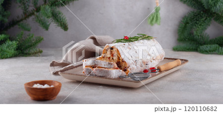 Festive fruitcake slice on rustic plate Festive fruitcake slice on rustic plate 120110682