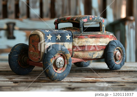 Rustic patriotic retro toy car with American flag design on wooden background Rustic patriotic retro toy car with American flag design on wooden background 120111037
