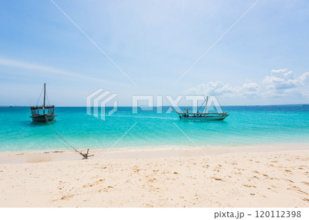 boats near a seashore anchored boats near a seashore anchored 120112398