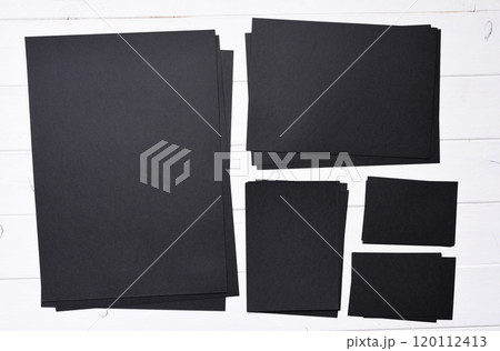stacks of black paper 120112413
