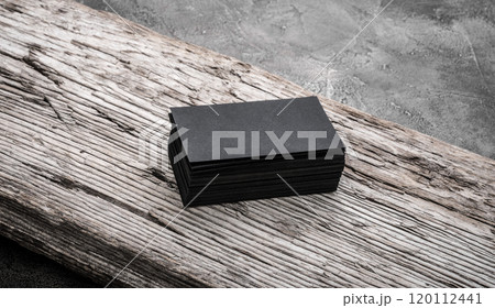 Black blank name card on wooden background. 120112441