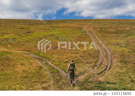 Female Tourist Walking on Mountain Trekking Trail 120113692