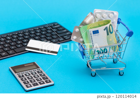 Ordering Medicines. Pills and Capsules in a Shopping Cart on Blue Background 120114014