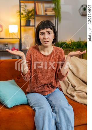 Confused woman raising hands asking why, what reason of failure, demonstrating disbelief irritation Confused woman raising hands asking why, what reason of failure, demonstrating disbelief irritation 120114602